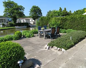 Guest house 490326 - Holiday property IJsselmeerkust - huisje 143, bootje, aan het water, grote tuin en terrassen